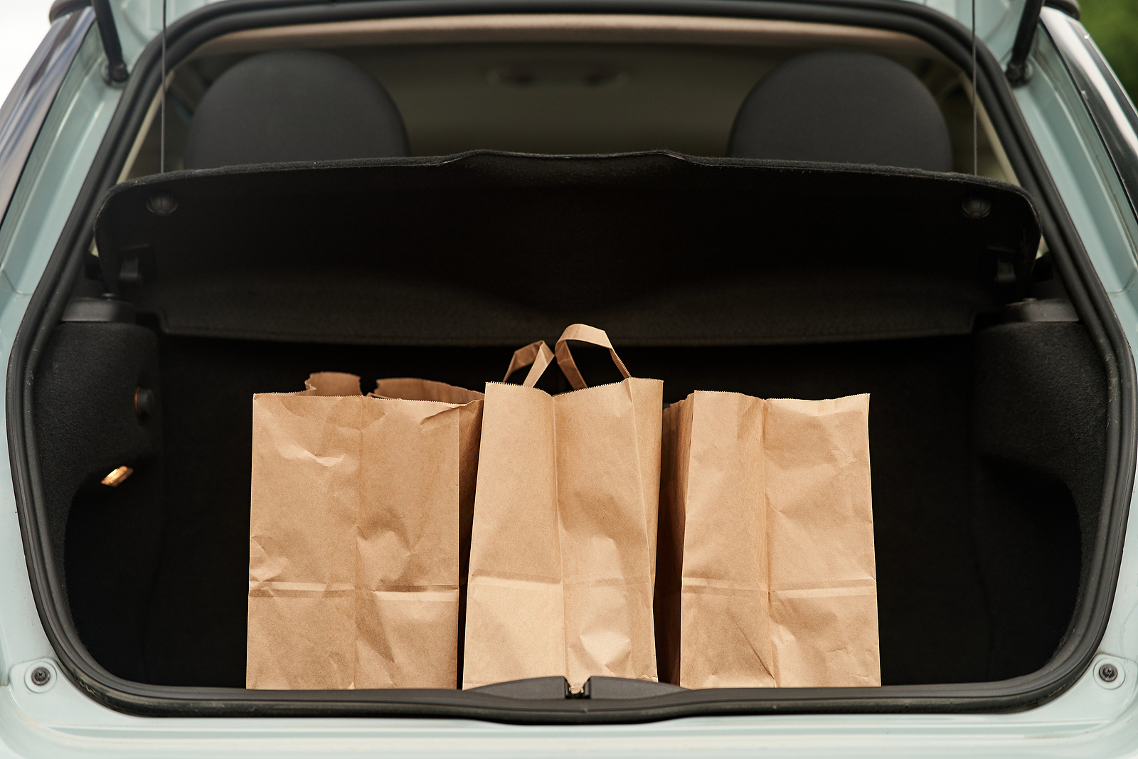 paper bags in a car trunk